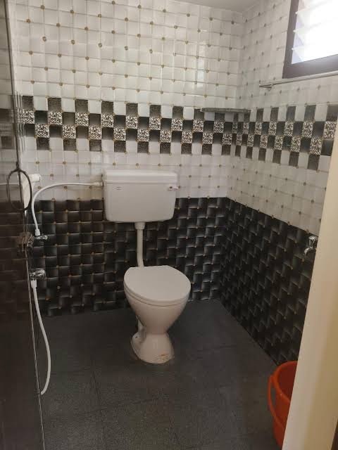 Modern bathroom with tiled walls and toiletries